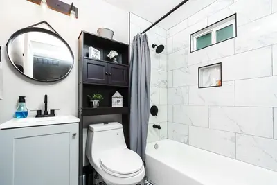 a bathroom with a toilet and a sink and a mirror at Entire 2 bedroom Pet Friendly Guest Cottage in Alpine