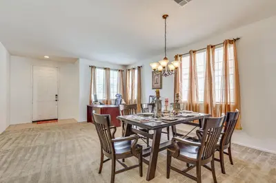 a dining room with a table and chairs at Large Menifee Home 1 Block to Neighborhood Park! in Menifee