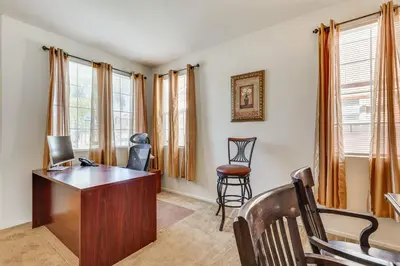 a home office with a desk and chairs at Large Menifee Home 1 Block to Neighborhood Park! in Menifee