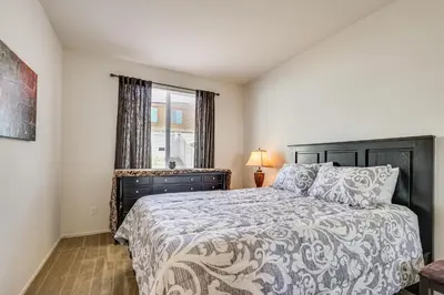 a bedroom with a bed and a window at Large Menifee Home 1 Block to Neighborhood Park! in Menifee