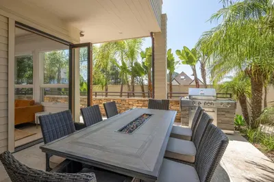 an outdoor patio with a table and chairs at Ocean View Del Mar Beach Home w Jacuzzi in San Diego