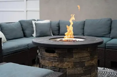 a fire pit in a living room with a couch at Spacious Beach House! Walk to Beach and Pier in Oceanside