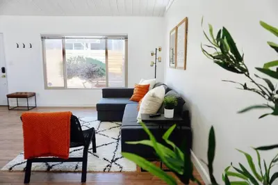 a living room with a couch and a chair at San Diegos Best Zoo, SeaWorld and Downtown Nearby in San Diego