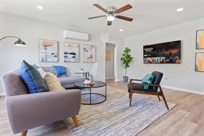 a living room with a couch and a table at 15 min to San Diego! Walk to Trolley in El Cajon