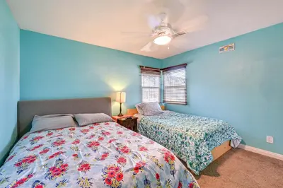 a bedroom with two beds and a ceiling fan at Spring Valley Family Home 13 Mi to San Diego! in Spring Valley