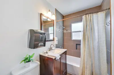 a bathroom with a sink and a toilet and a tub at Spring Valley Family Home 13 Mi to San Diego! in Spring Valley