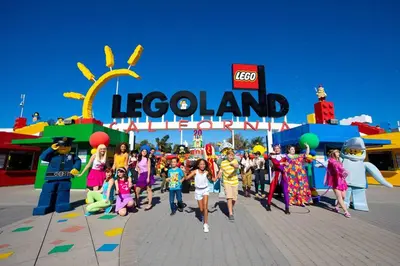 a group of children walking in front of a legoland amusement park at Shabby Chic Oceanside King & 2 Queen bed Pool GYM in Oceanside