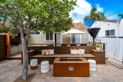 a patio with a bench and a tree at Pacific Beach Bungalow Just Steps to Beach in San Diego