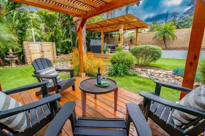 a patio with chairs and a table and a gazebo at Outdoor Haven with Spa Walk to La Jolla Shores Beach in San Diego