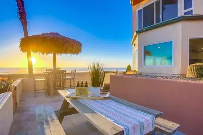 a picnic table with a view of the beach at Aloha Breeze 1 in San Diego