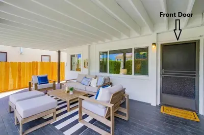 a living room with a couch and a tv at Avalon Beach 2 in San Diego