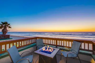 a fire pit on a balcony overlooking the ocean at Aqua in San Diego