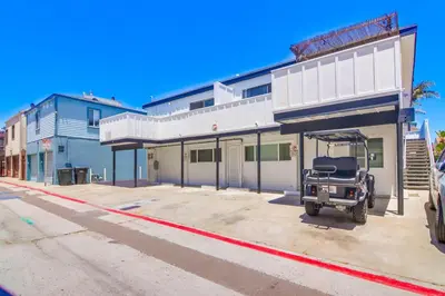 a vehicle parked in front of a building at Avalon Beach 3 in San Diego