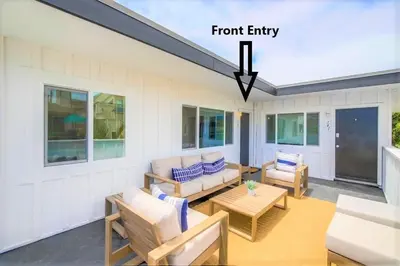 a room with a porch with a couch and chairs at Avalon Beach 4 in San Diego