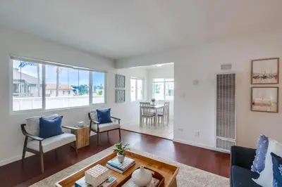 a living room with a couch and a table at Avalon Beach 4 in San Diego