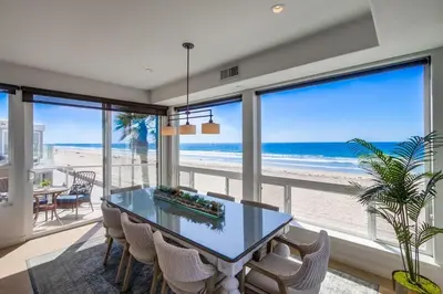 a dining room with a view of the beach at Aloha Breeze 2 in San Diego