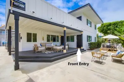 a front entry of a white house with a patio at Avalon Beach 1 in San Diego