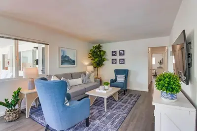 a living room with a couch and a table at Avalon Beach 1 in San Diego