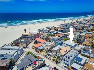 an aerial view of a beach with buildings and the ocean at Avalon Beach 1 in San Diego