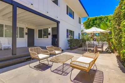 a group of chairs and tables on a patio at Avalon Beach 1 in San Diego
