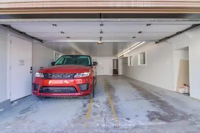 a red car is parked in a garage at Bay Style 2 in San Diego