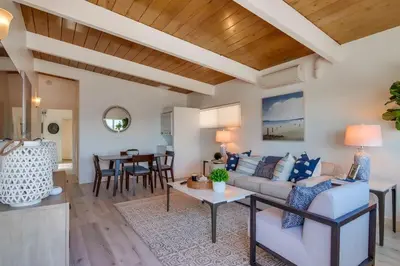 a living room with a couch and a table at Bayside 5 in San Diego