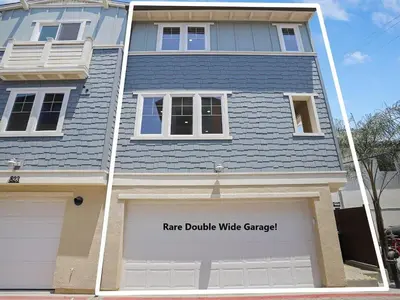 a house with a garage with a sign on it at Bayside Cove 3 in San Diego