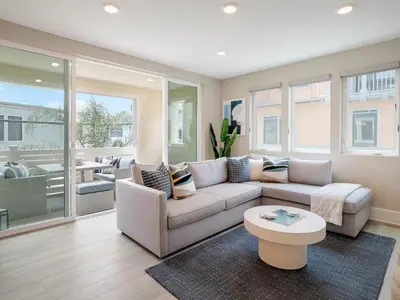a living room with a couch and a table at Bayside Cove 3 in San Diego
