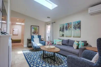 a living room with a couch and chairs and a table at Beach & Bay in San Diego