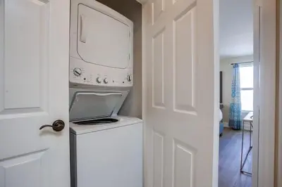 a white washer and dryer in a room at Beach & Bay in San Diego