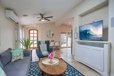 a living room with a couch and a tv at Beach & Bay in San Diego