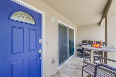 a blue door in a room with a table at Beach Break 1 in San Diego