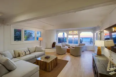a living room with a couch and a table at Beacons in Encinitas