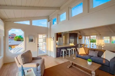 a living room with a couch and a table at Beacons in Encinitas