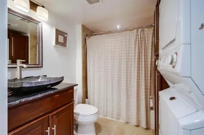 a bathroom with a sink and a toilet and a shower at Belmont Shores in San Diego