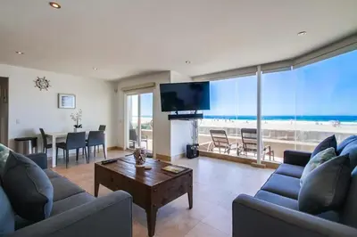 a living room with a couch and a table at Belmont Shores in San Diego