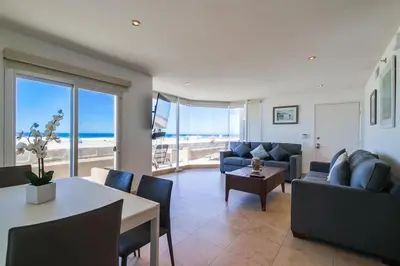 a living room with a view of the ocean at Belmont Shores in San Diego