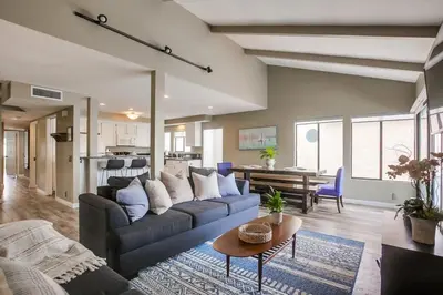 a living room with a couch and a table at Beach Style 1 in San Diego