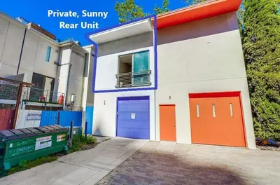 a building with colorful doors on the side of it at Kettner Row 2 in San Diego