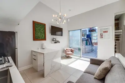 a living room with a couch and a desk and a chair at Kettner Row 2 in San Diego