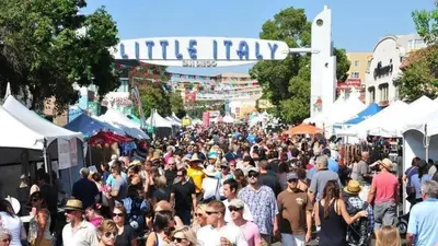 a large crowd of people walking through a market at Kettner Row 2 in San Diego