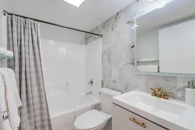 a white bathroom with a sink and a toilet at Kettner Row 2 in San Diego