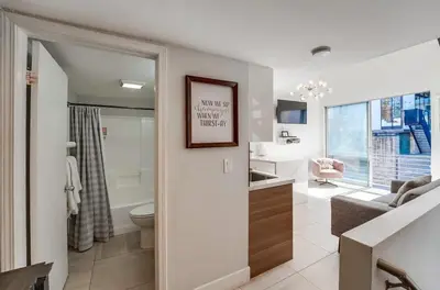 a white bathroom with a toilet and a sink at Kettner Row 2 in San Diego