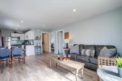 a living room with a couch and a table at Beachy Keen 2 in San Diego