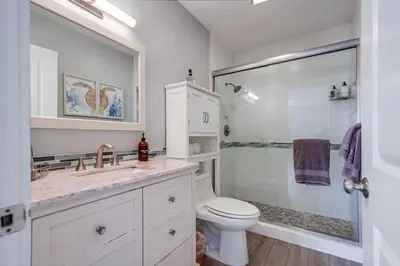 a bathroom with a sink and a toilet and a shower at Beachy Keen 2 in San Diego