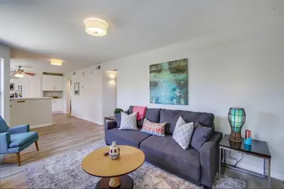 a living room with a couch and a table at Local Gem 2 in San Diego