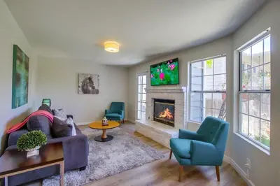 a living room with a couch and a fireplace at Local Gem 2 in San Diego