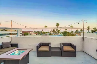 a patio with a table and chairs on a balcony at Local Gem 4 in San Diego