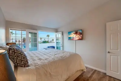 a bedroom with a bed with a view of the ocean at Local Gem 4 in San Diego
