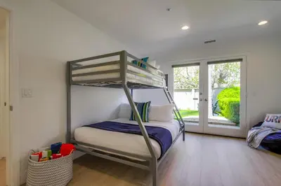 a bedroom with a bunk bed in a house at Ocean Oasis in Encinitas